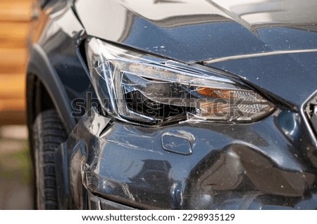 Broken front light after a car accident on a gray modern car. Stock photo © 