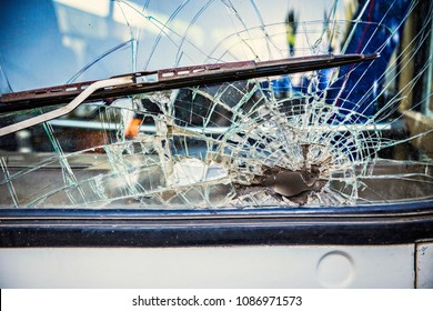 Broken Front Window Glass In The Bus Close Up 