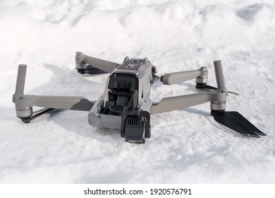 Broken Gimbal Camera And Drone Motor Arm After Crash On Snowy Road Close Up