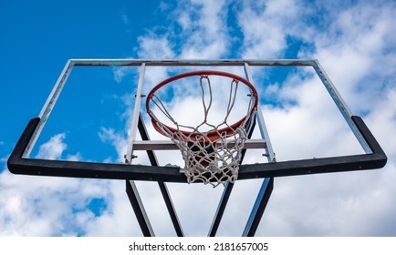 Broken Glass Backboard And Broken Hoop On The Basketball Court