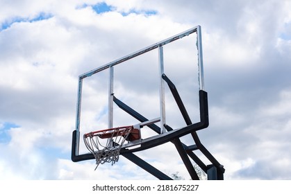 Broken Glass Backboard And Broken Hoop On The Basketball Court