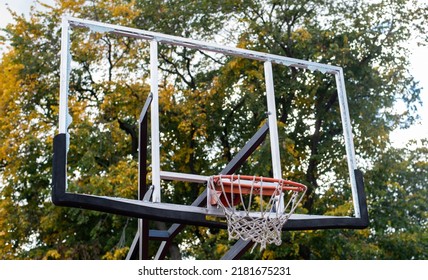 Broken Glass Backboard And Broken Hoop On The Basketball Court