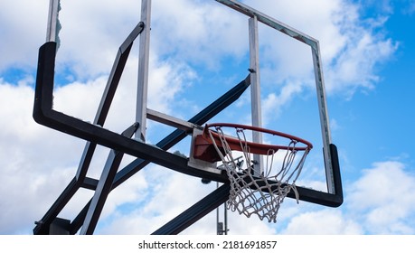 Broken Glass Backboard And Broken Hoop On The Basketball Court