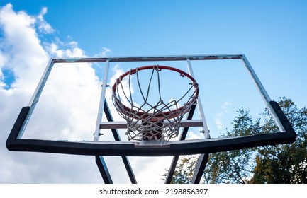 Broken Glass Backboard And Broken Hoop On The Basketball Court