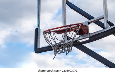 Broken Glass Backboard And Broken Hoop On The Basketball Court