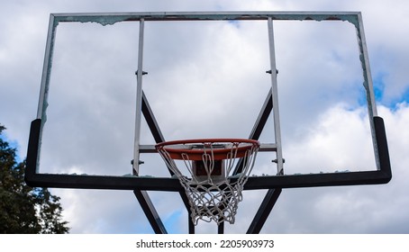 Broken Glass Backboard And Broken Hoop On The Basketball Court