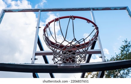 Broken Glass Backboard And Broken Hoop On The Basketball Court