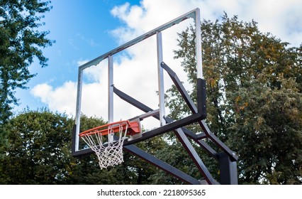 Broken Glass Backboard And Broken Hoop On The Basketball Court