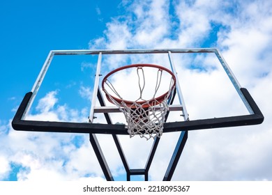 Broken Glass Backboard And Broken Hoop On The Basketball Court