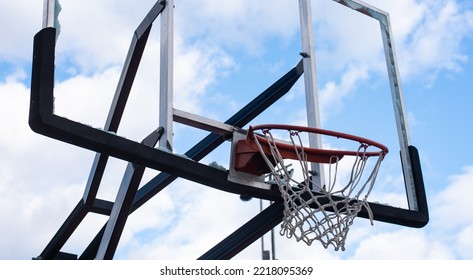 Broken Glass Backboard And Broken Hoop On The Basketball Court