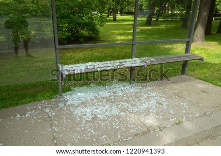 Broken glass at the bus stop.This is a manifestation of wild vandalism.