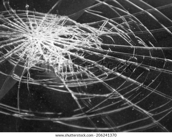 Broken\
glass in car. Abstract black-and-white\
background