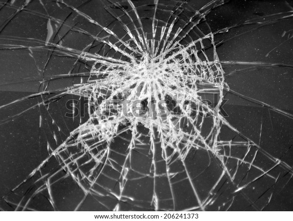 Broken\
glass in car. Abstract black-and-white\
background