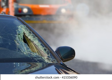 Broken Glass Of Car In An Accident And Road Roller 
