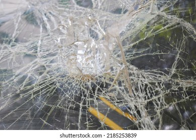 Broken Glass In Car. Close-Up Of Shattered Windshield.