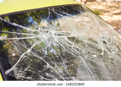 Broken Glass In Car. Close-Up Of Shattered Windshield.