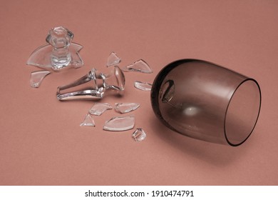 A Broken Glass Goblet Lies On The Table.