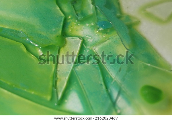 Broken glass and green water
paint