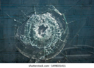 
Broken Glass. Hole Hole In The Window Pane. Close-up.