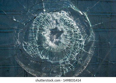 
Broken Glass. Hole Hole In The Window Pane. Close-up.