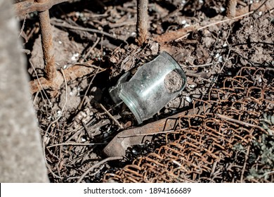 Broken Glass Jar On The Ground. Trash