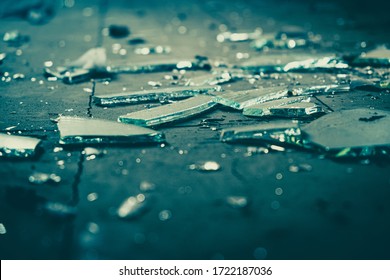 Broken Glass Lies On A Wooden Floor