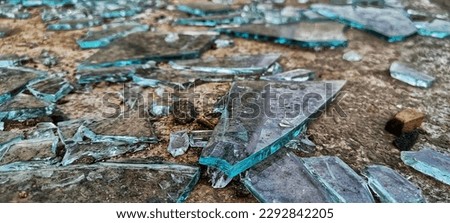 Broken glass lying on the floor, shattered glass, abstract - broken glass texture