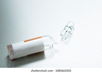 Broken Glass Of Medication Vial After Drawing Drug