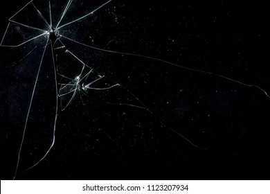 A Broken Glass On A Black Background, Shattered Pieces Not Too Far Away From Each Other. Useful Texture For Overlay.
