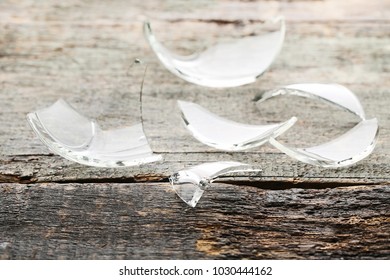 Broken Glass On Grey Wooden Table