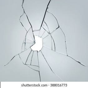 Broken Glass On White Background With Hole