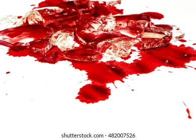 shattered glass on the floor with blood