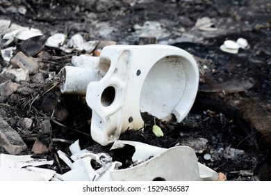 Broken Glass, Toilet Bowl, Bottles After A Fire. Hard Rubbish. Environmental Pollution