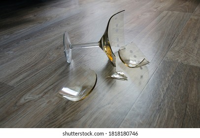  A Broken Glass Vase On The Floor.