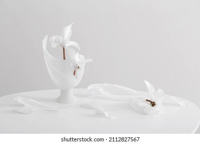 Broken Glass Vase With White Cyclamen On White Background