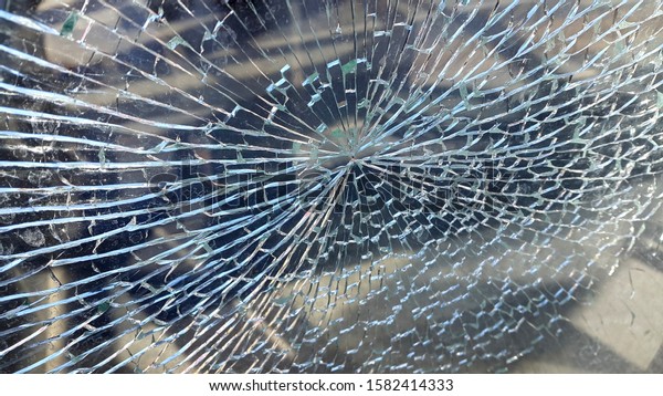 Broken glass window.\
Abstract vintage background. Crack on glass. Broken glass for\
background pattern