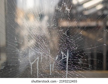 Broken Glass Window. Close-Up Of Shattered Windshield