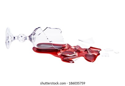 Broken glass of wine. Poured red wine, like blood. Isolated on white background. Studio shoot. Clipping path included.