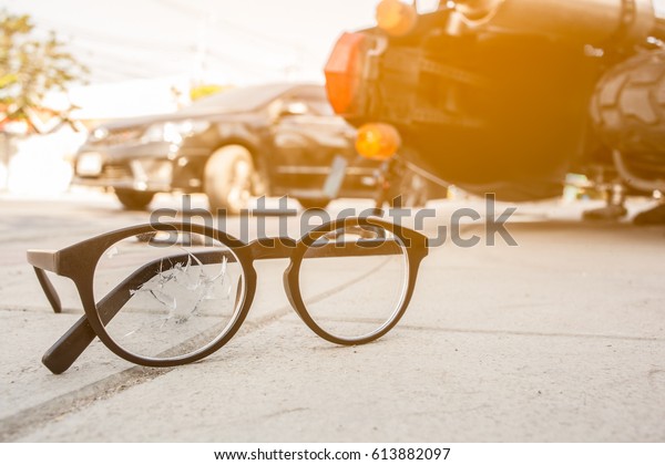 Broken glasses with motorcycle accident on the
city street