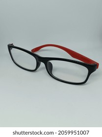 Broken Glasses. Red Black Glasses. Broken Glasses On Isolated White Background.