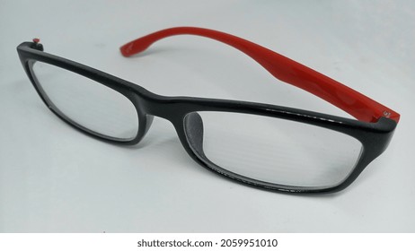 Broken Glasses. Red Black Glasses. Broken Glasses On Isolated White Background.