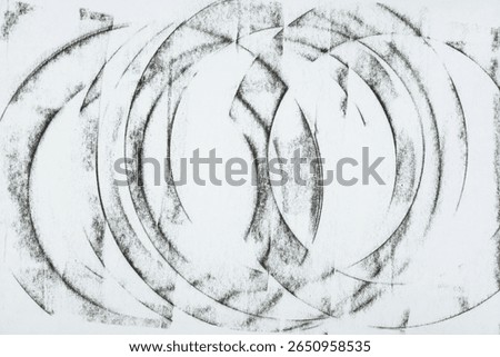 broken graphite layered concentric ring pattern on blank paper