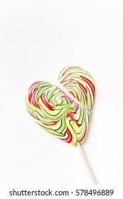 Broken Heart Lollipops, Love. Candy, Top View Flat Lay On White Paper. Breakup, Divorce Sad Couple, Betrayal. Sweet Sucker Lollipop Candy, Isolated Minimal Concept Above Decoration, Food Background