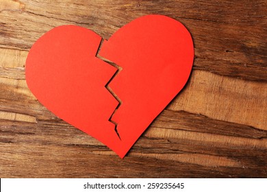 Broken Heart On Rustic Wooden Table Background