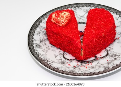 Broken Heart Shaped Cake With Red Decoration In Black And White Porcelain Plate On White Background