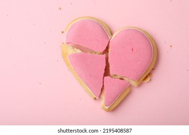 Broken Heart Shaped Cookie On Pink Background, Top View. Relationship Problems Concept