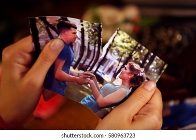 Broken heart woman. Couple break up. Woman and man quarrel. Close up of female hands tearing family pictures.