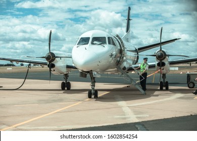 Broken Hill, Australia- October 16 2009 : A Pilot Stands On The Stairs Of His Commercial Small Plane