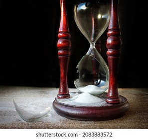          Broken hourglass - sand clock                      