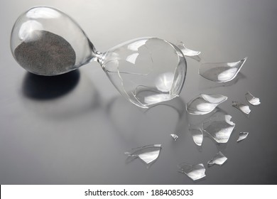 broken hourglass. waste of time. end of opportunity. stop measuring hours. shards of glass. shattered hope.